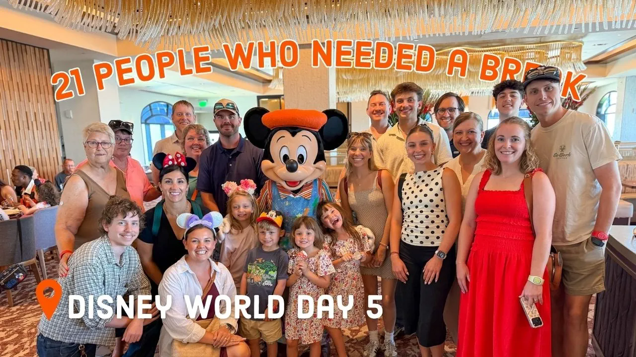 PixieDustedMom thumbnail: a large family group of about twenty people posing with Mickey Mouse at a character meal, curved orange text reading 21 PEOPLE WHO NEEDED A BREAK across the top, and white text with a location pin reading DISNEY WORLD DAY 5 at the bottom left